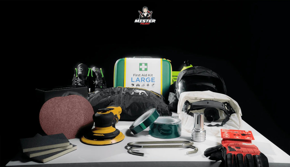 Équipement complet de protection et outils pour spécialiste thermolaquage professionnel sur fond noir